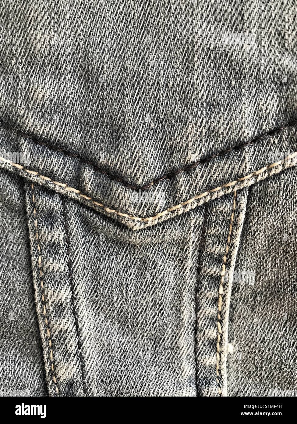 Denim detail. Close-up of stitching in denim garment. - Smartphone Captured Stock Image
