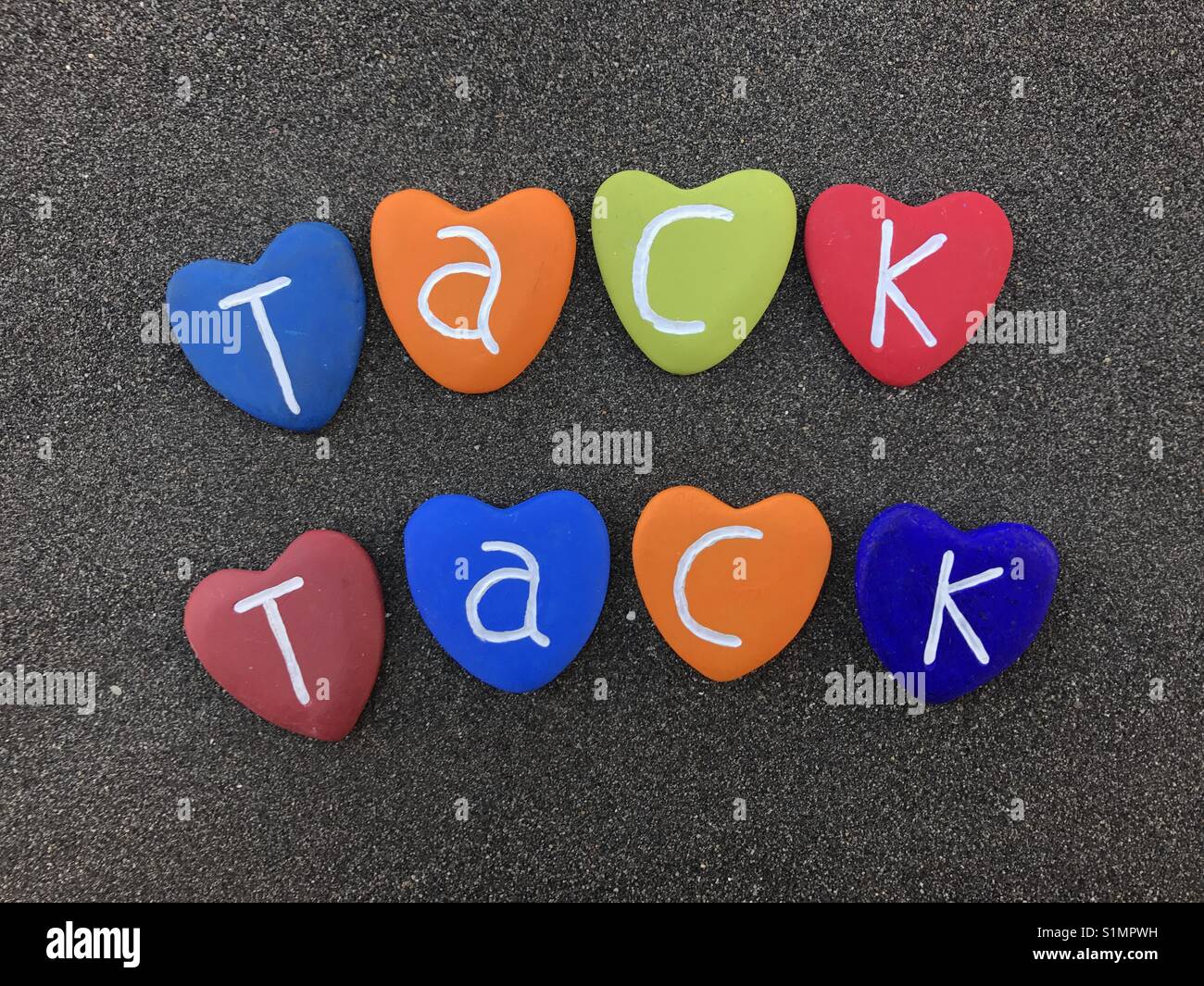 Tack, tack, double thank you in swedish with colored heart stones over