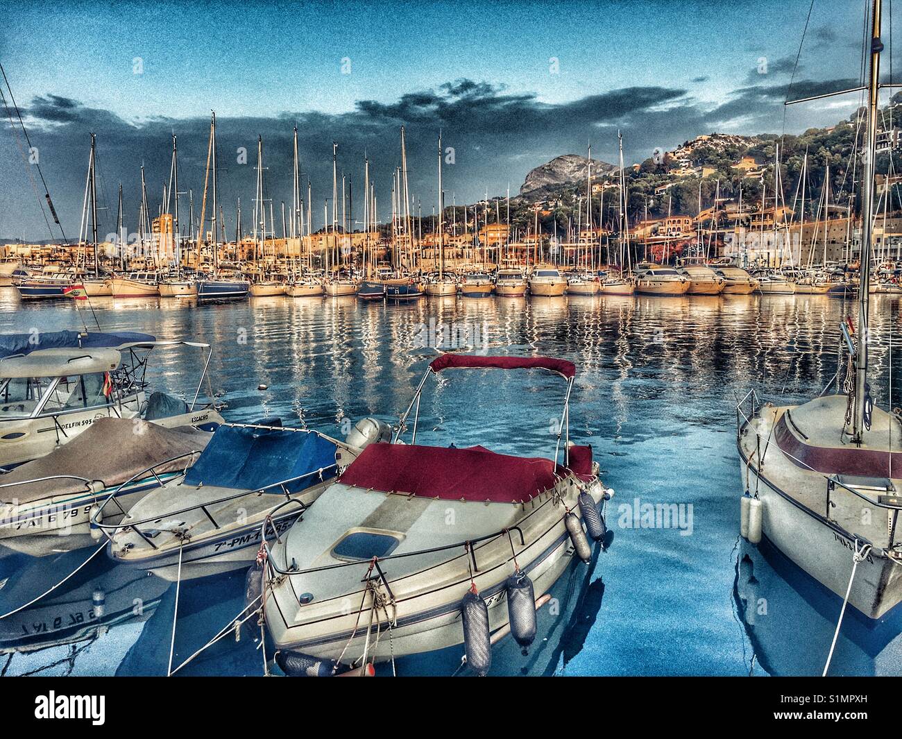 View over the yacht club towards the fishing boats, Montgo mountain and port of Javea, Alicante, Spain Stock Photo