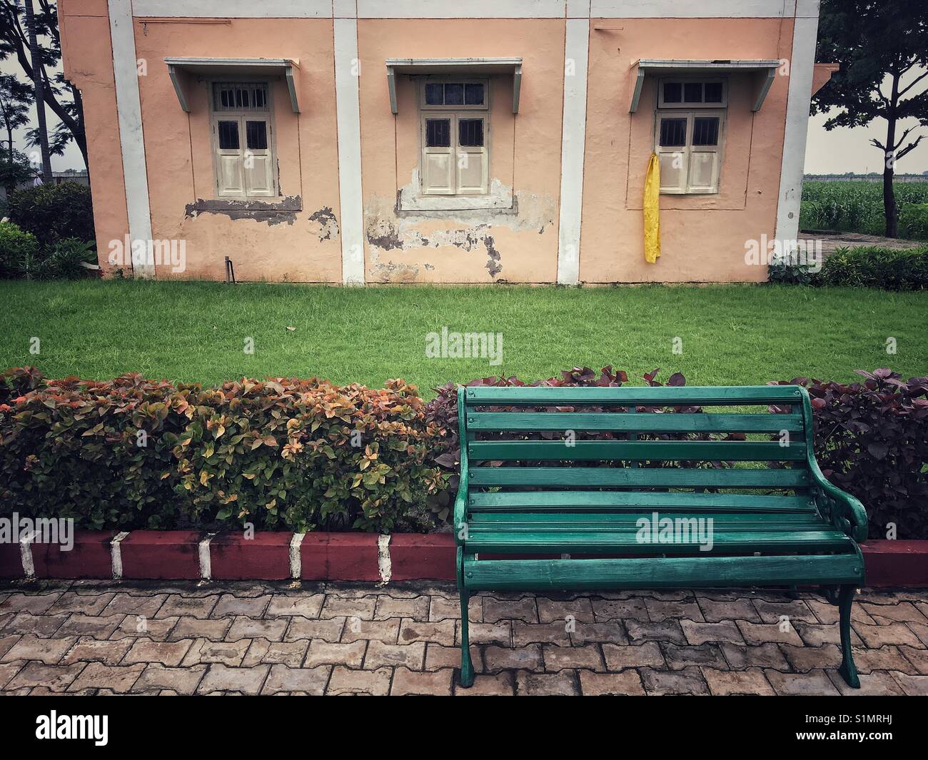 A empty bench in garden area of religious place in Burhanpur . - Smartphone Captured Stock Image