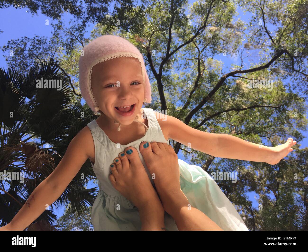 A daughter being lifted on her mother's feet Stock Photo Alamy