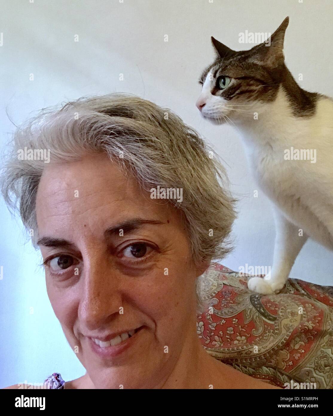 Mature woman and cat. Close view. - Smartphone Captured Stock Image