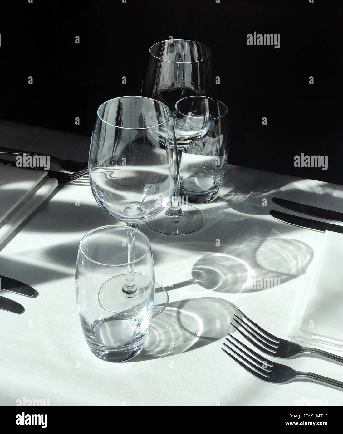A place setting in a restaurant including glasses - Smartphone Captured Stock Image