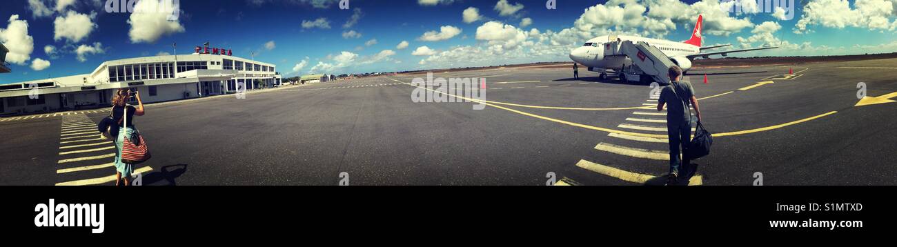 Passenger taking picture of airplane on airport in Pemba, Mozambique, Africa Stock Photo