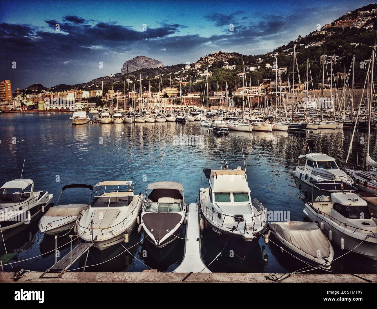 Early morning view of port area of Javea / Xabia on the Costa Blanca, with Montgo Mountain in the background. Alicante Province, Spain - Smartphone Captured Stock Image