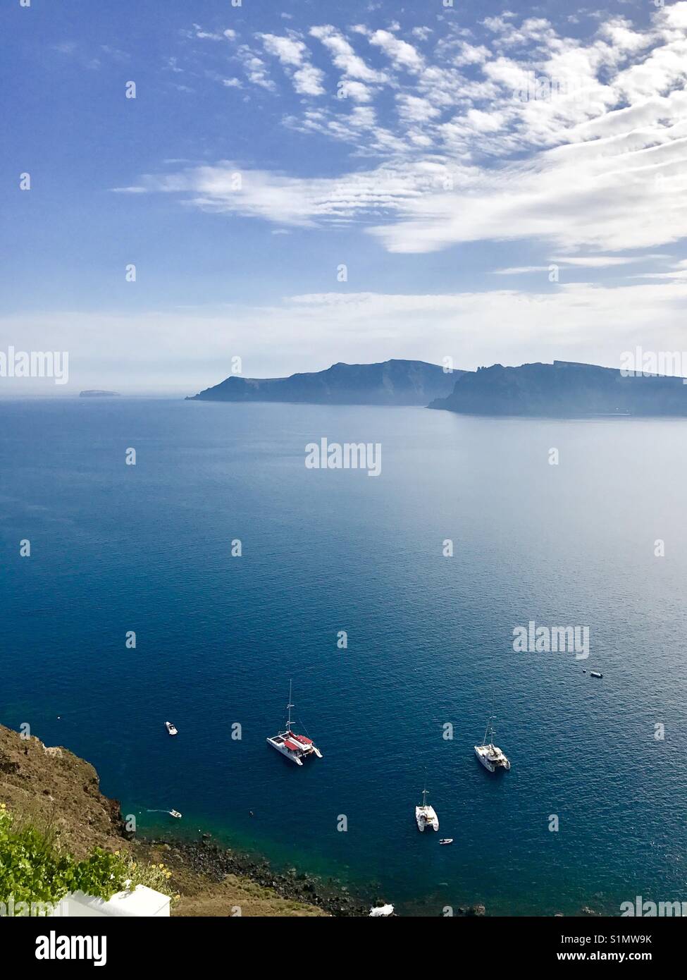 View of Thirasia island from Santorini - Smartphone Captured Stock Image