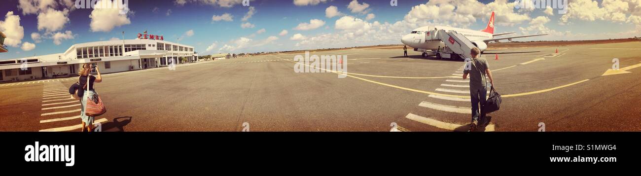 Passenger taking photo of airplane on airlines Pemba, Mozambique, Africa Stock Photo