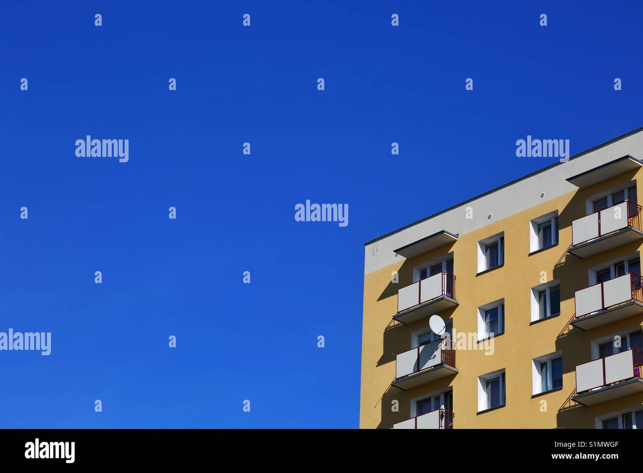 Close up of a modernistic building against blue sky Stock Photo