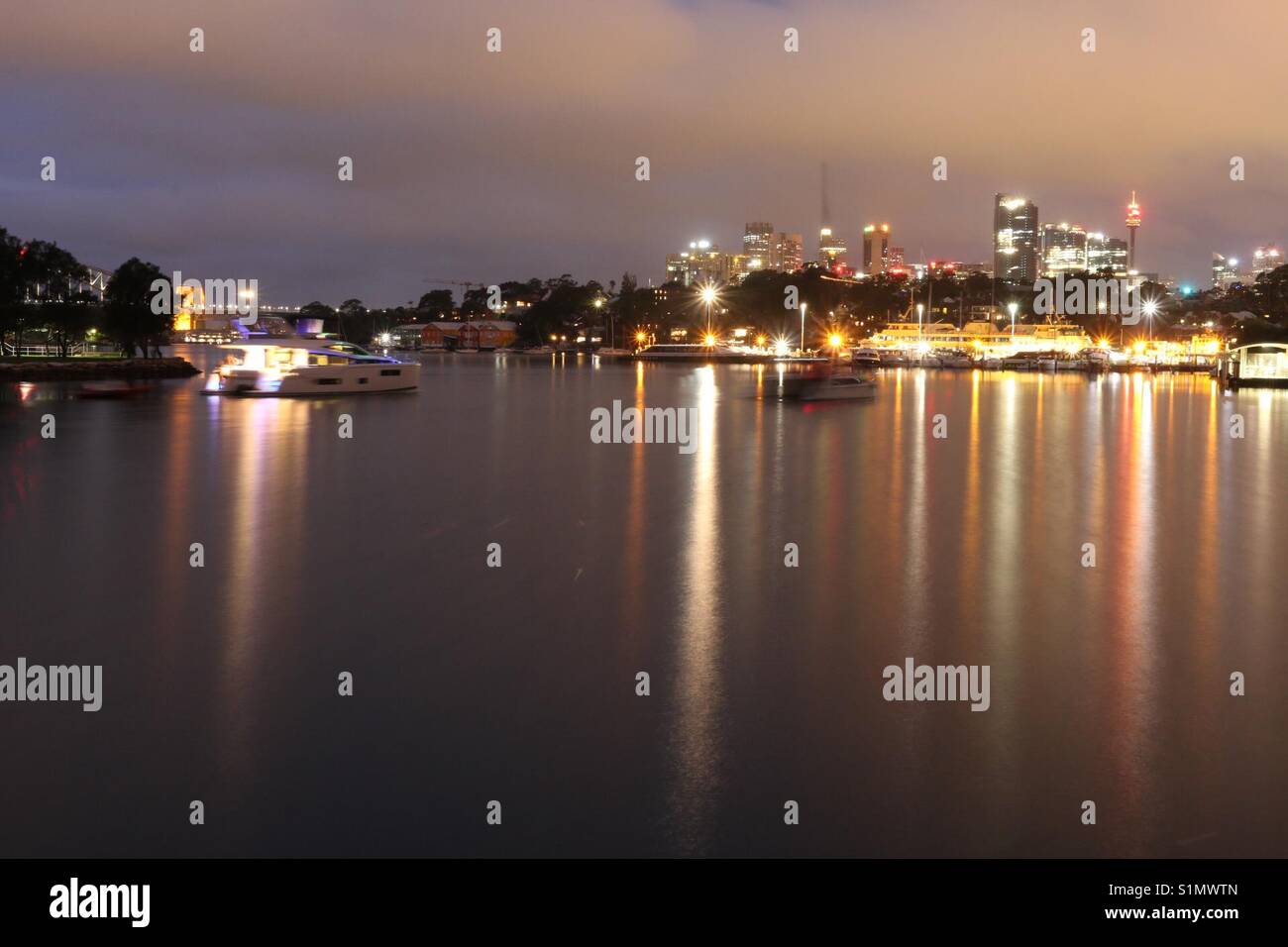 A photo of Sydney lights on dark water Stock Photo