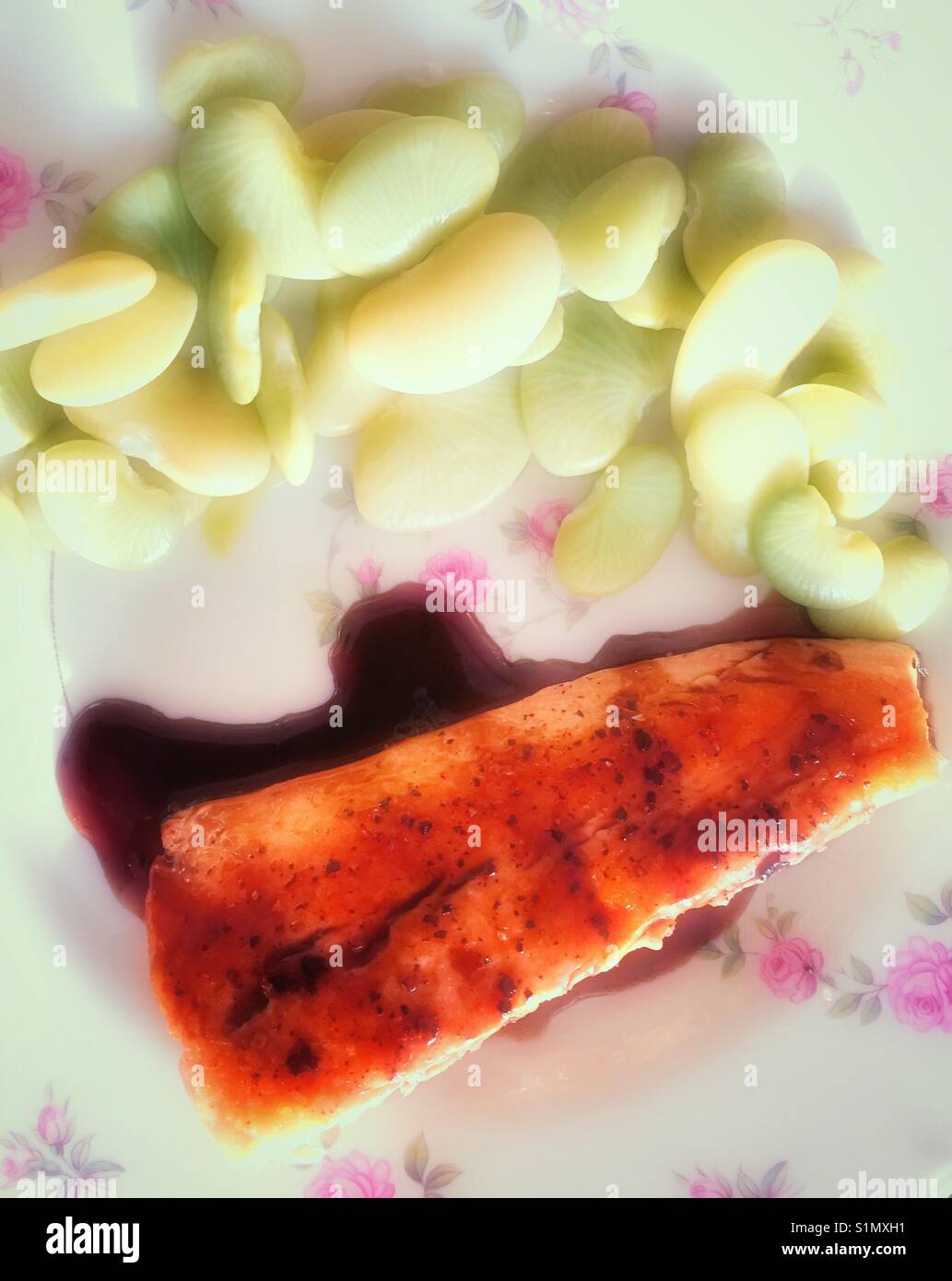 Gourmet meal of salmon with balsamic reduction and Dr. Martin heirloom lima beans, USA - Smartphone Captured Stock Image