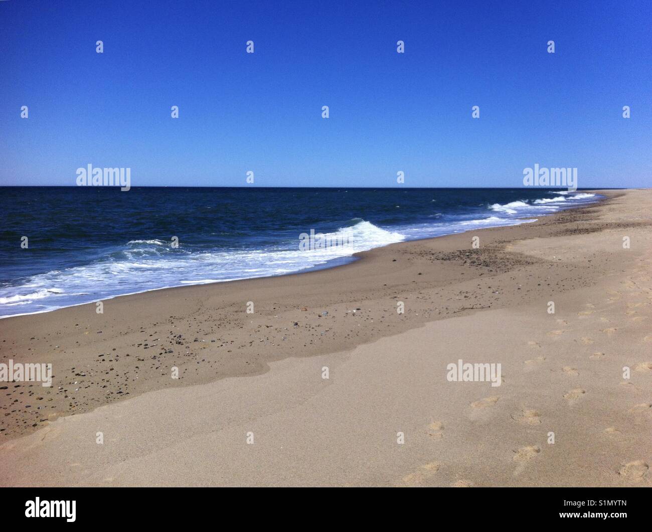 Deserted beach on Cape Cod on a bright sunny Spring day - Smartphone Captured Stock Image