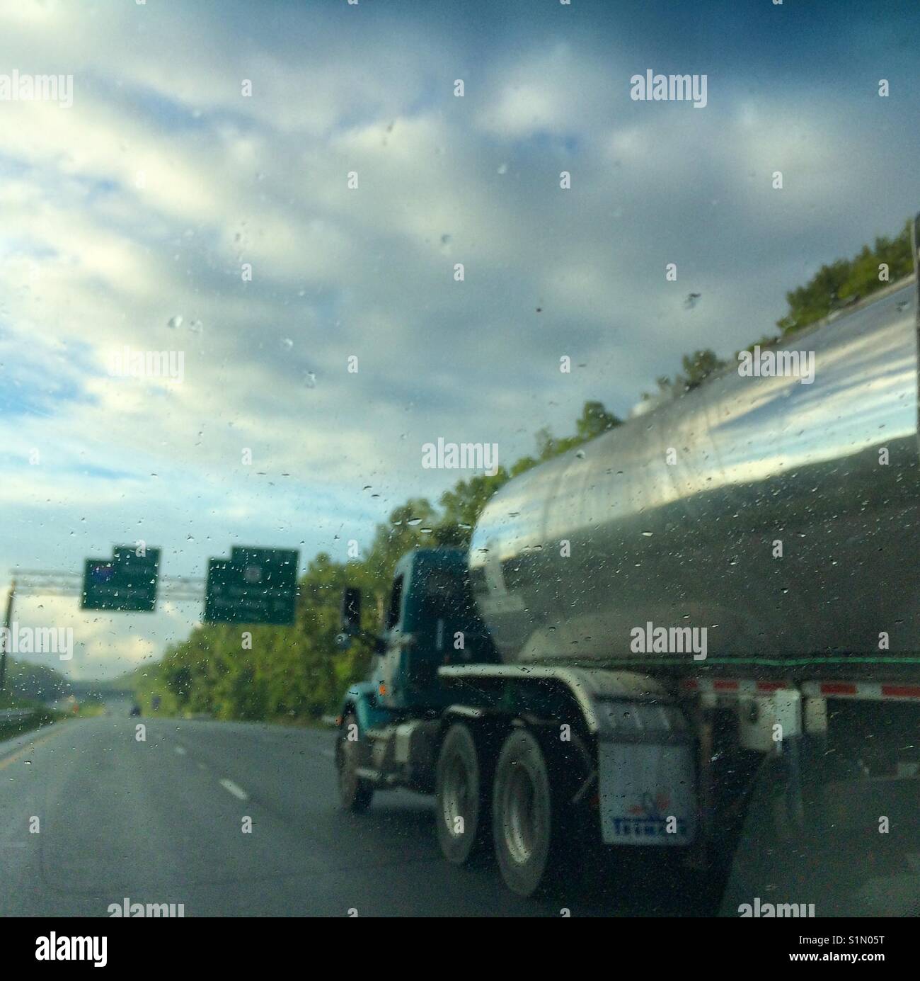 A truck passing by early on a rainy morning. - Smartphone Captured Stock Image