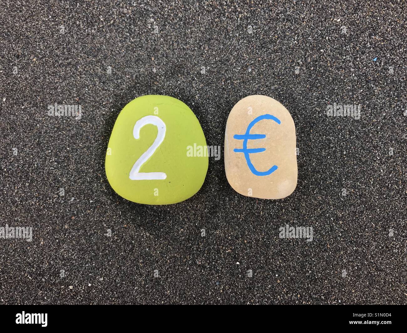 2 Euro with carved and colored stones - Smartphone Captured Stock Image