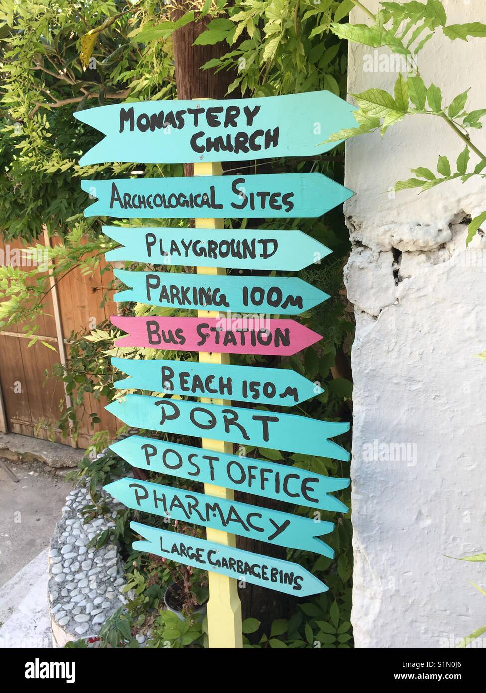 Signpost in Fiskardo fishing town on Kefalonia island in Greece - Smartphone Captured Stock Image