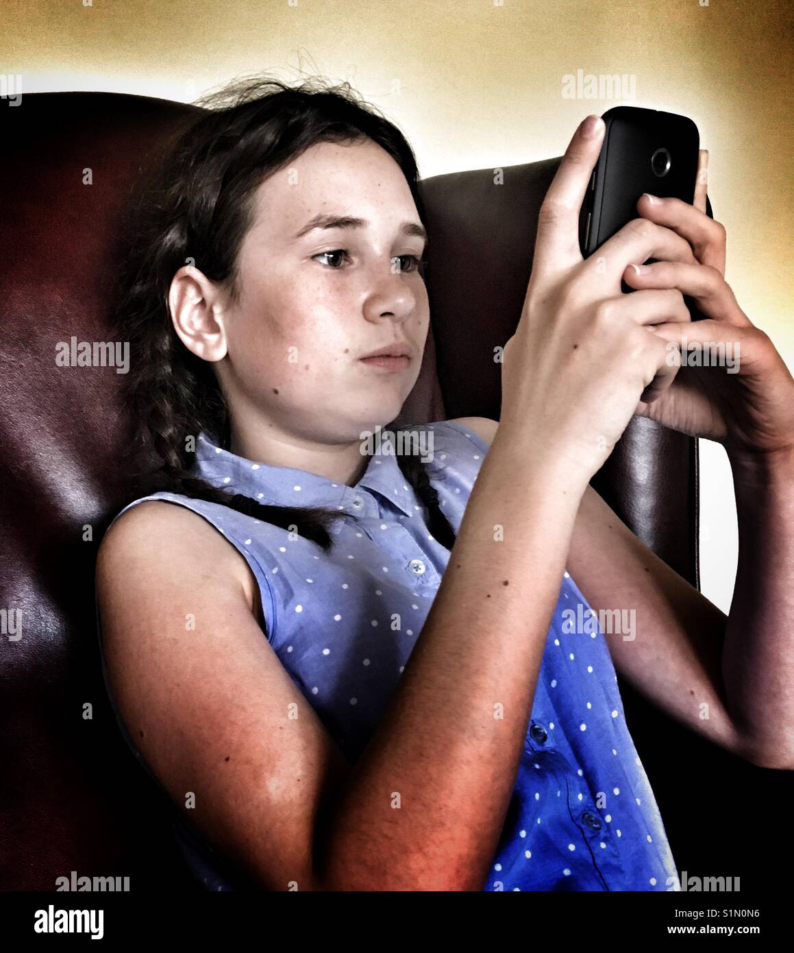 Girl on her mobile phone again - Smartphone Captured Stock Image