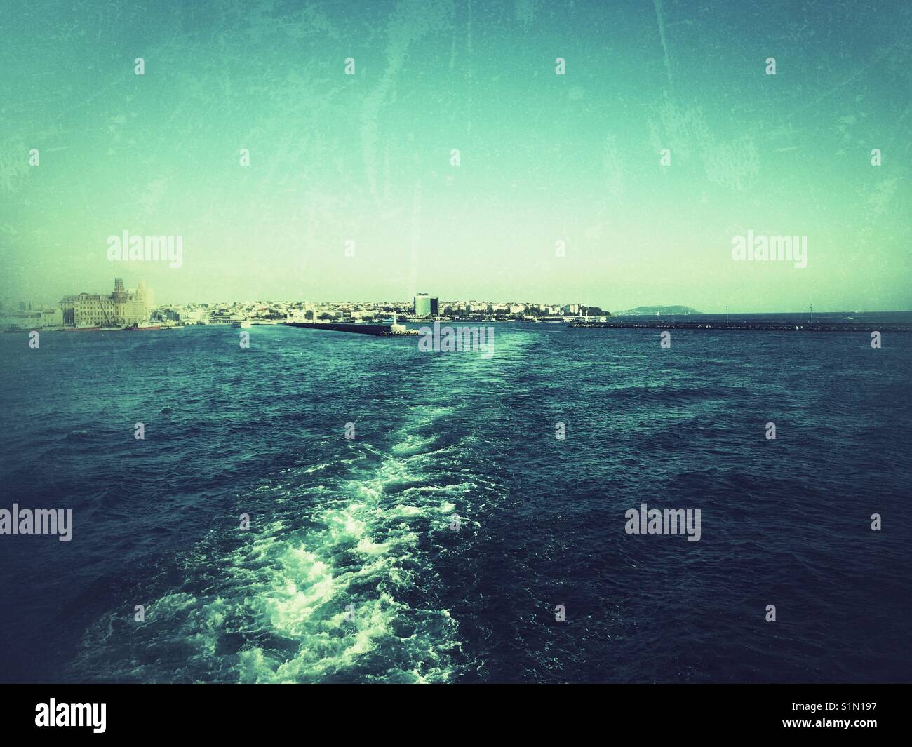 Boat white trail in the Bosphorus sea - Istanbul Turkey - Smartphone Captured Stock Image