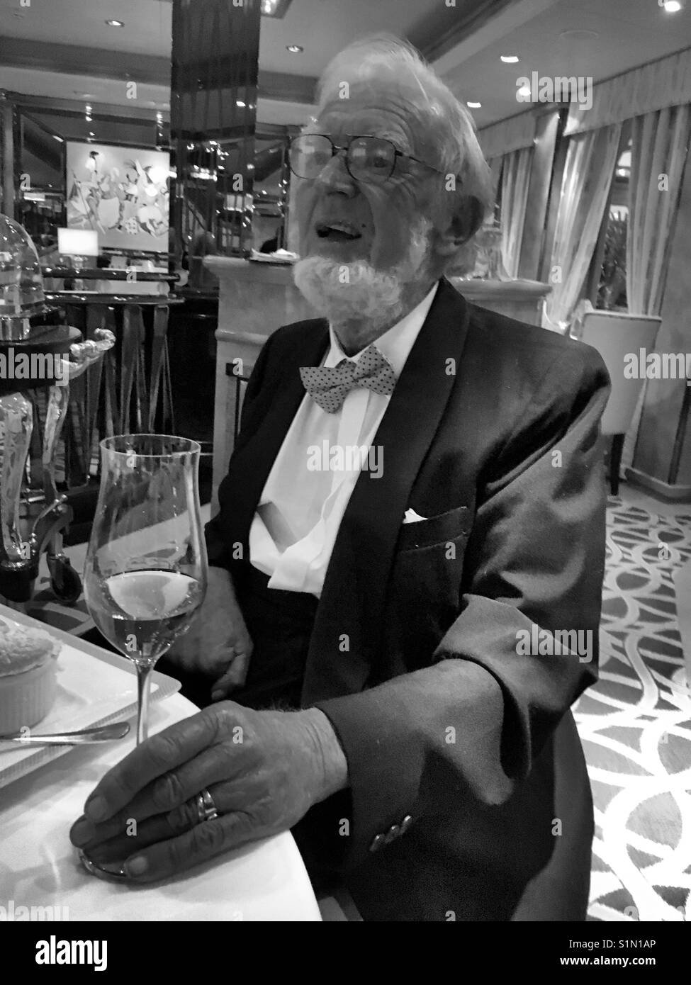 Elderly man fine dining Stock Photo