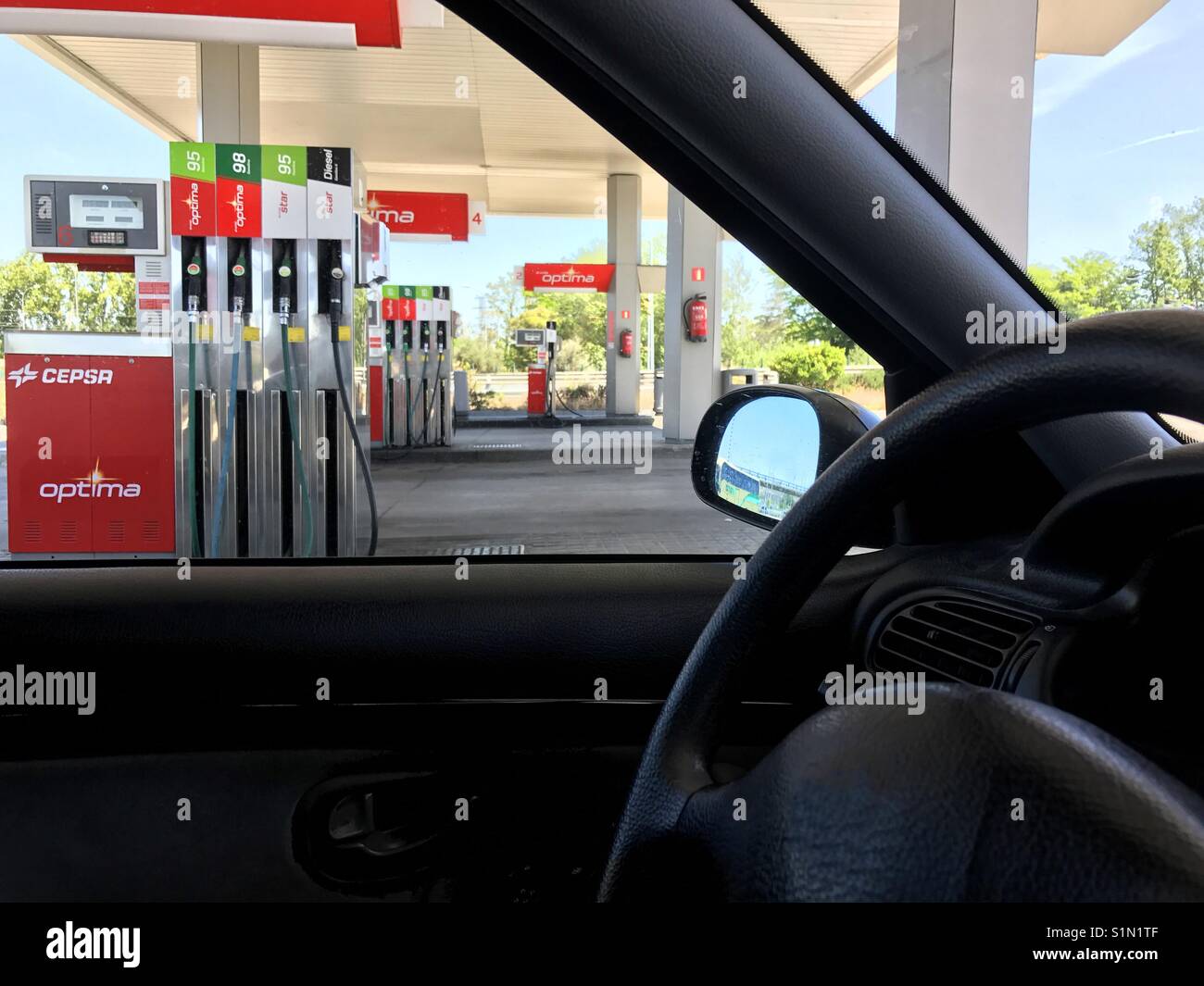 Gas station viewed from inside a car. - Smartphone Captured Stock Image
