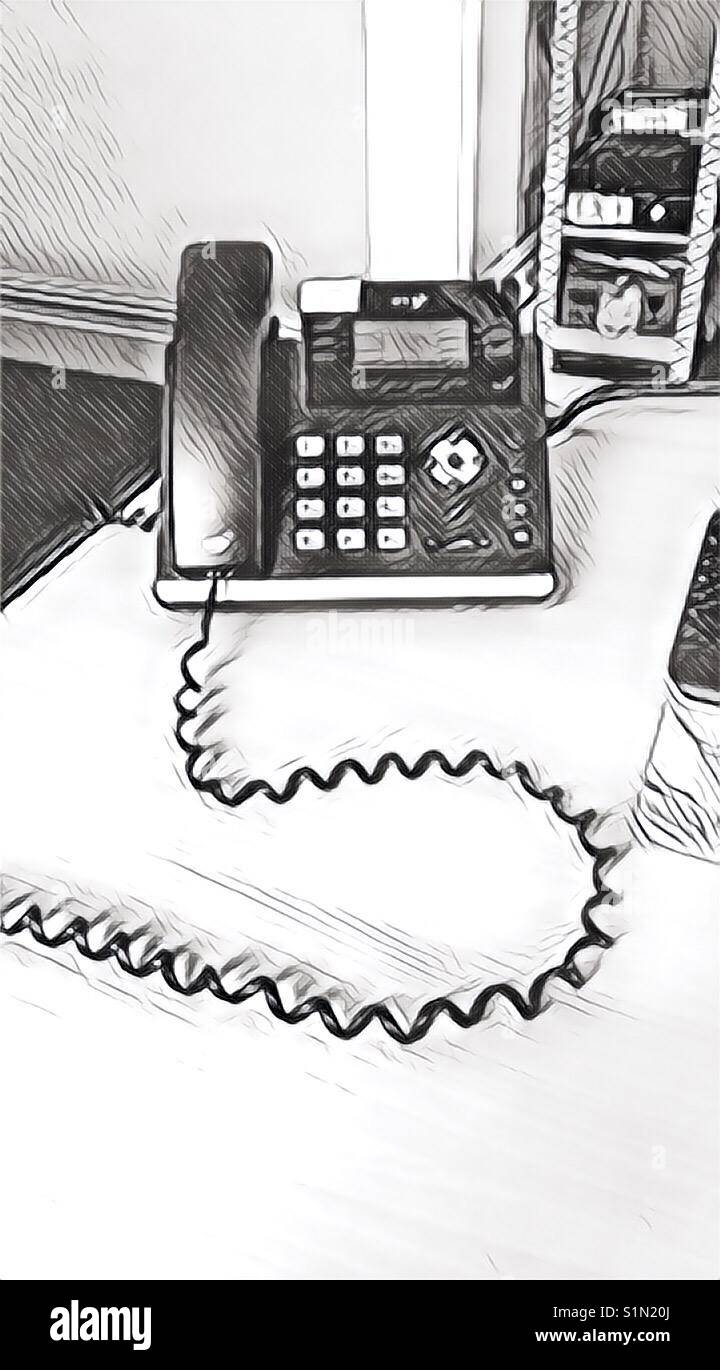 Monochrome office phone in filtered effect Stock Photo