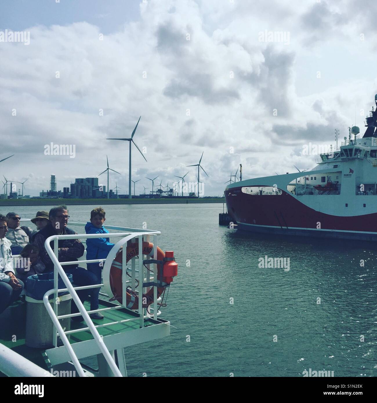 Ferry holland to germany in harbour with windmills Stock Photo