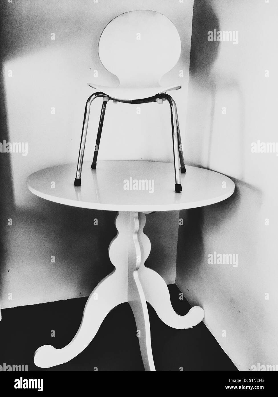 Chair stacked on table - Smartphone Captured Stock Image