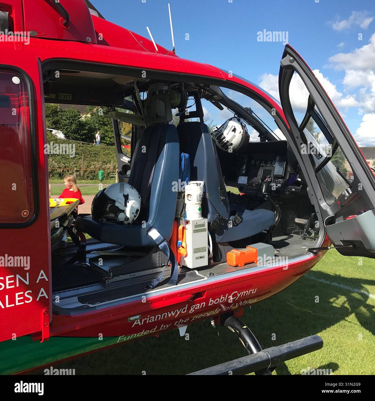 The cockpit of a Wales Air Ambulance on a sports field while on an emergency call out - Smartphone Captured Stock Image