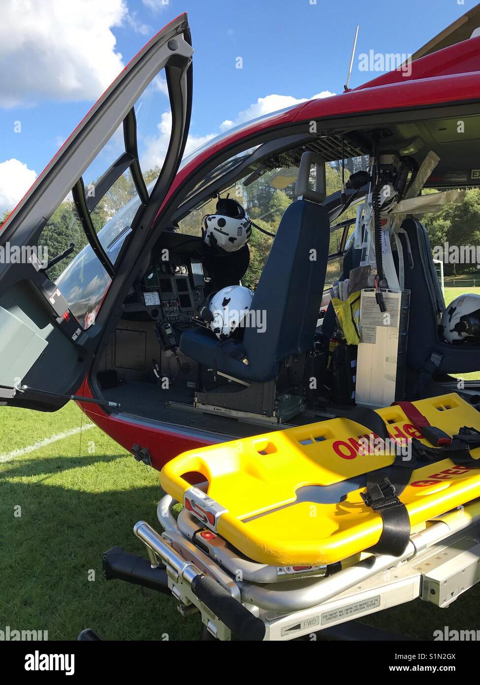 Cockpit of a Wales Air Ambulance showing the integrated patient stretcher - Smartphone Captured Stock Image
