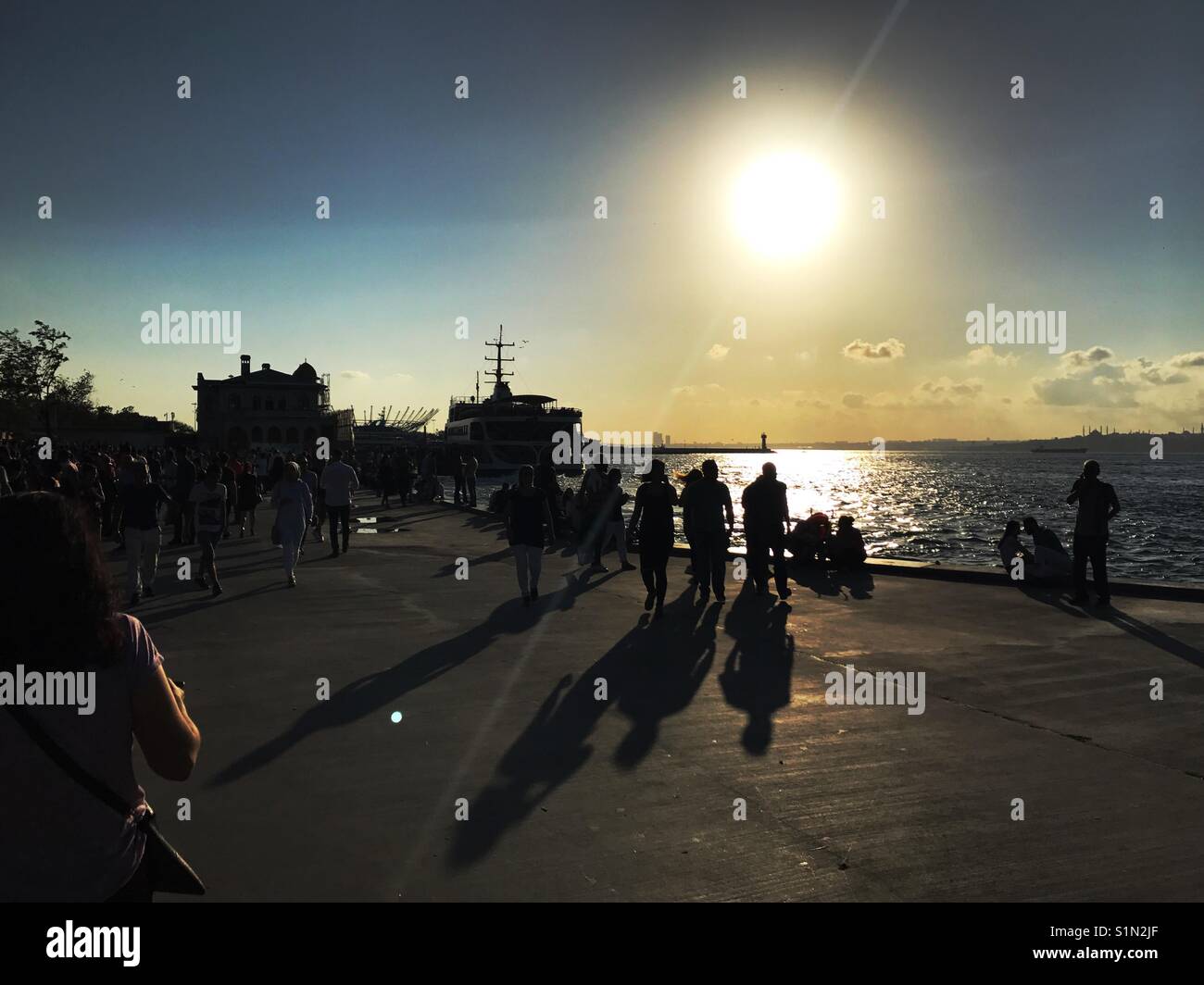 Kadikoy port with people at sunset - Smartphone Captured Stock Image