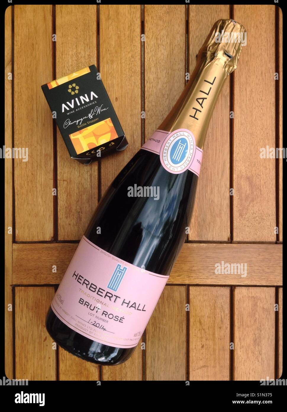 A bottle of Herbert Hall Brut Rosé English Sparkling Wine with an Avina