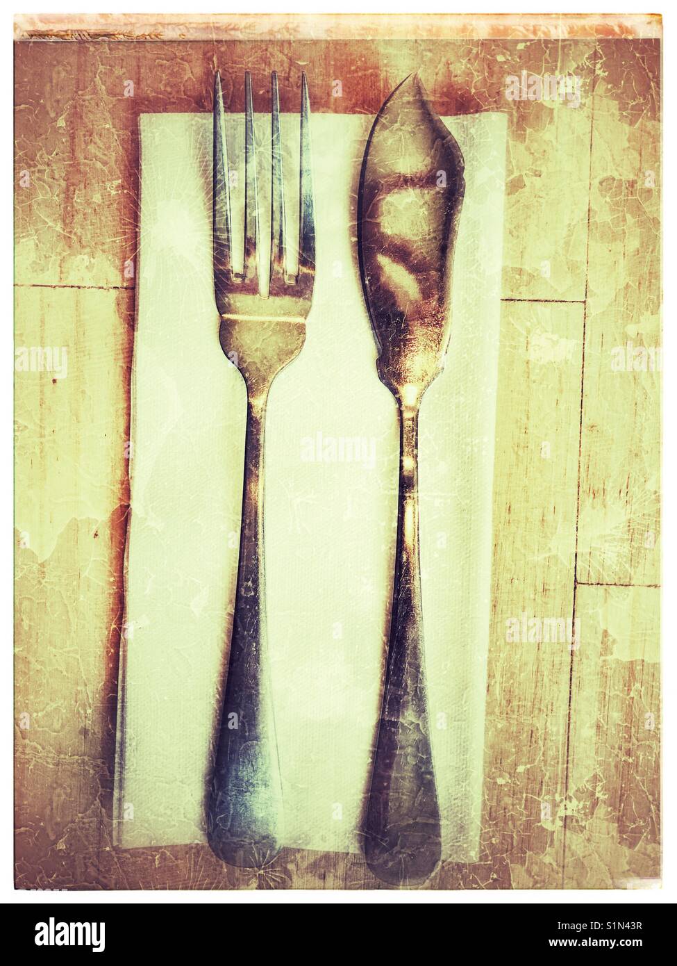 Fish knife and fork on serviette Stock Photo Alamy