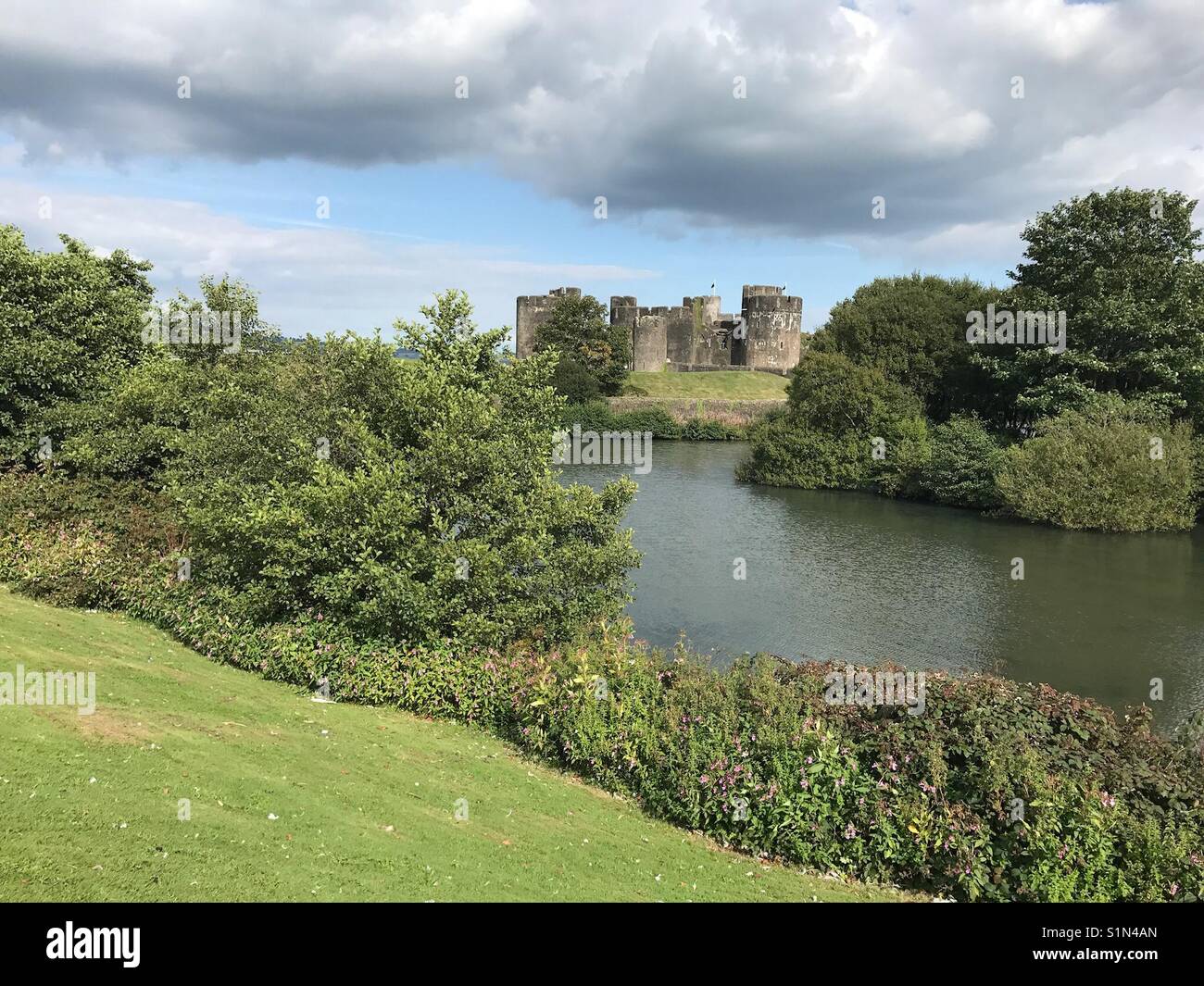Wide angle view of the park and moat around Caerphilly castle - Smartphone Captured Stock Image