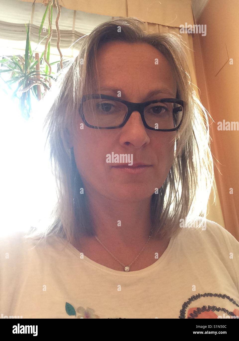 Backlight woman. - Smartphone Captured Stock Image