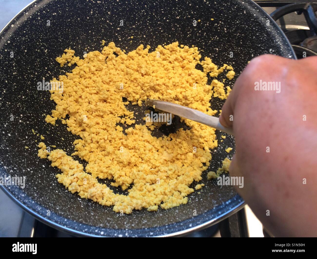 Cooking scrambled tofu. - Smartphone Captured Stock Image