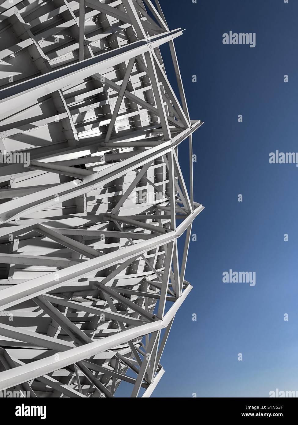 Abstract: part of a big satellite dish against a clear blue sky - Smartphone Captured Stock Image