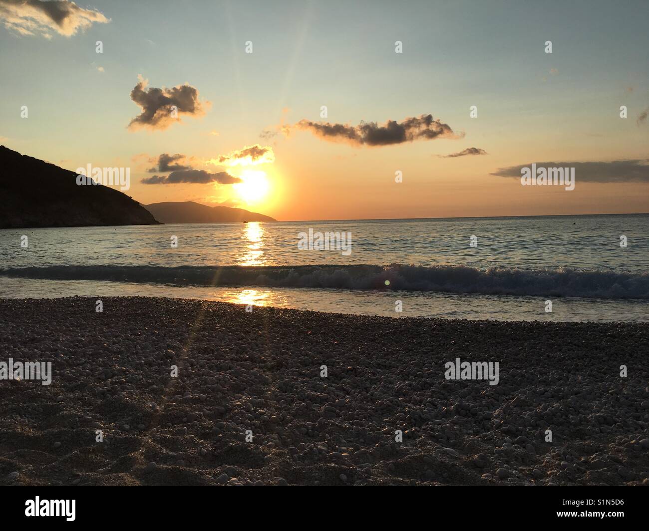 Sunset on Myrtos beach featured in film Captain Corelli's Mandolin on beautiful island of Kefalonia in Greece Stock Photo
