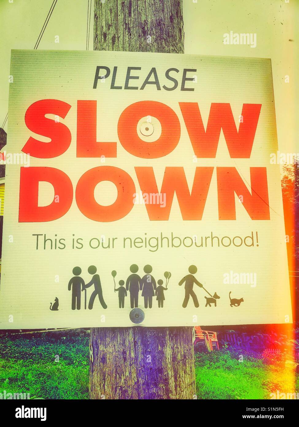 Neighbourhood please slow down sign, Canada - Smartphone Captured Stock Image