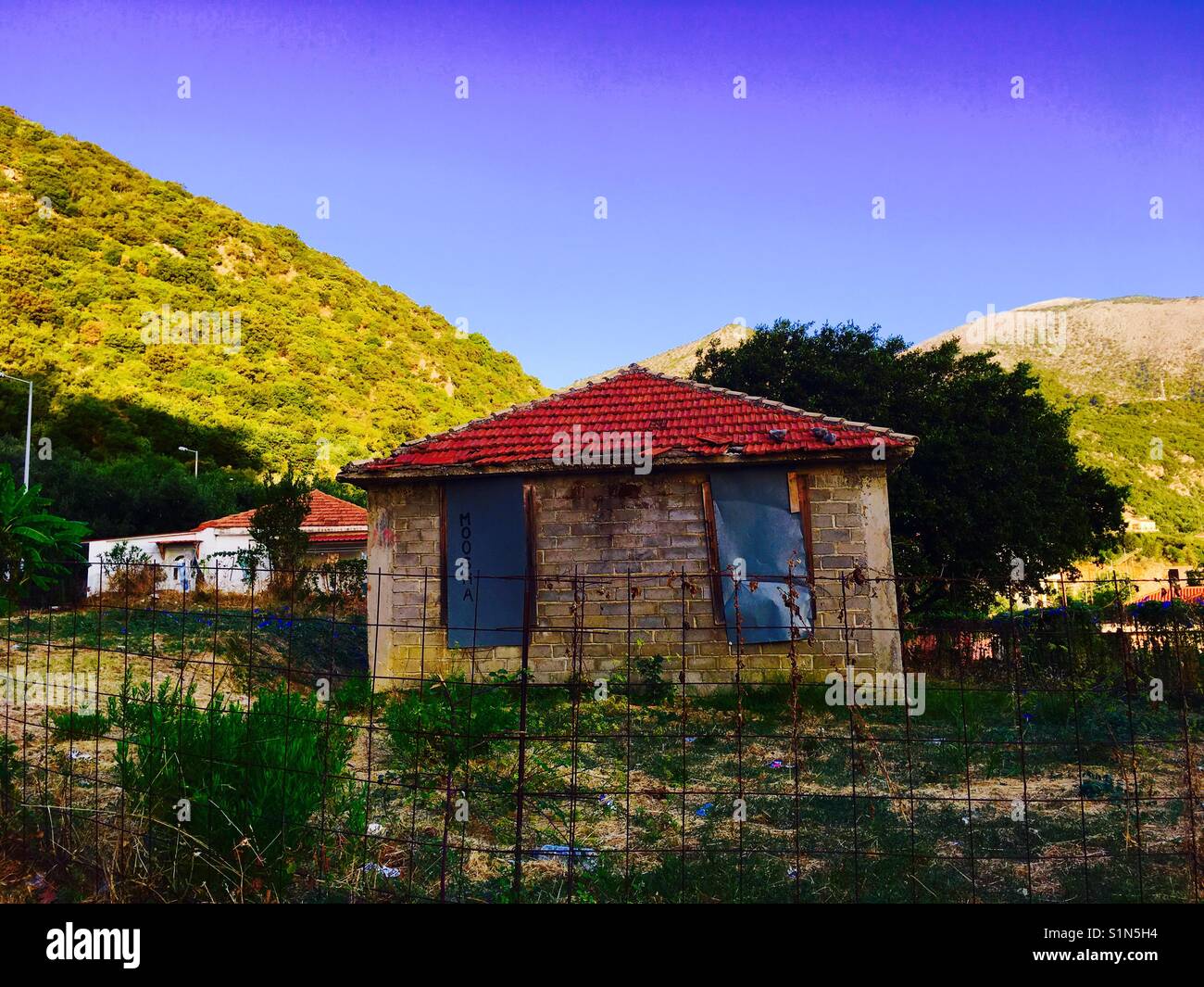 A house on the road on island of Kefalonia near Agia Irini in  Greece - Smartphone Captured Stock Image