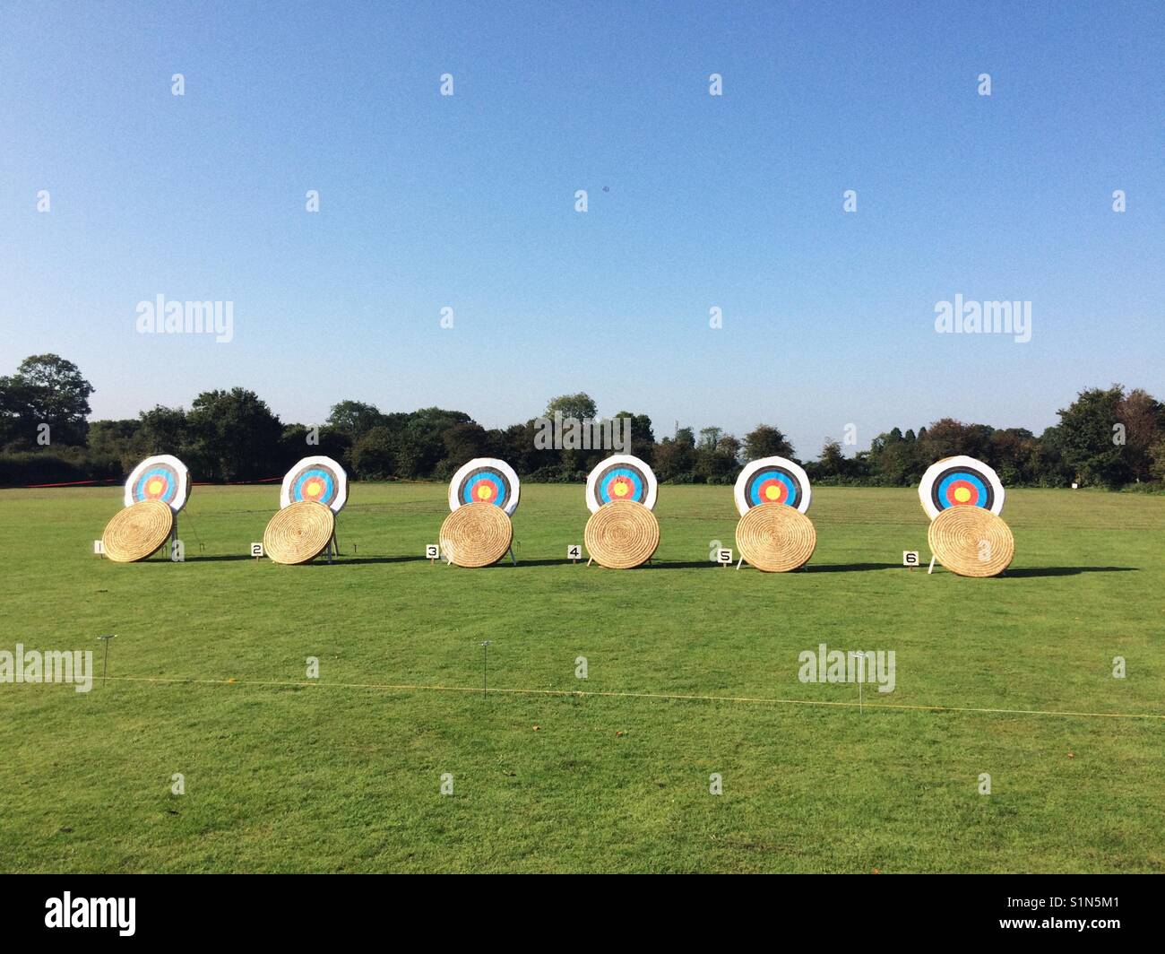 Archery targets or bosses lined up ready for a shoot. - Smartphone Captured Stock Image