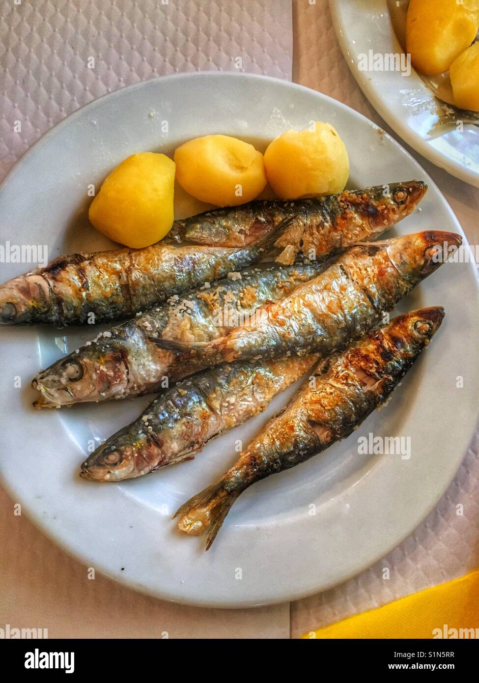 Sardines and boiled potatoes Stock Photo Alamy
