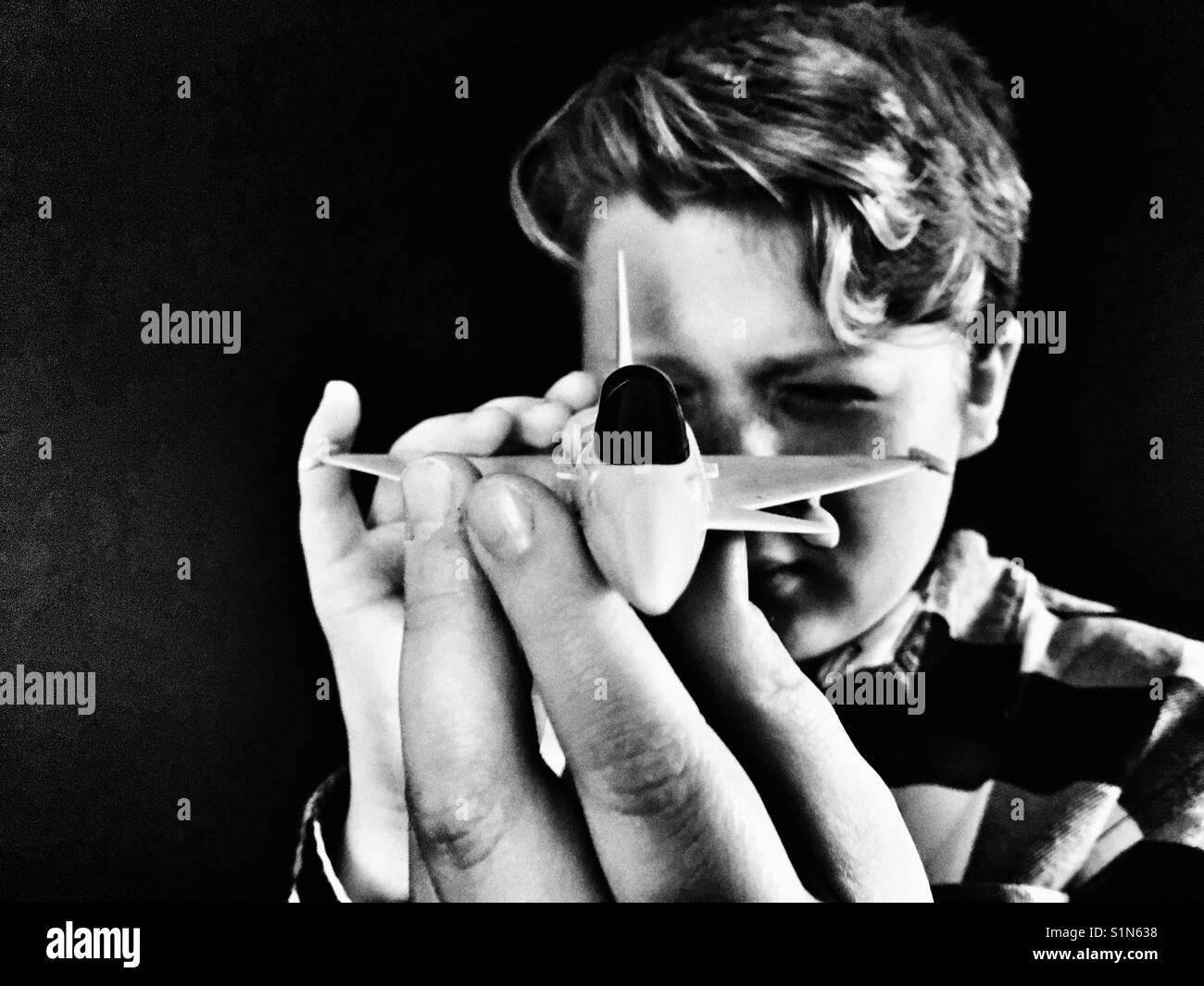 Boy Playing with model aircraft - Smartphone Captured Stock Image