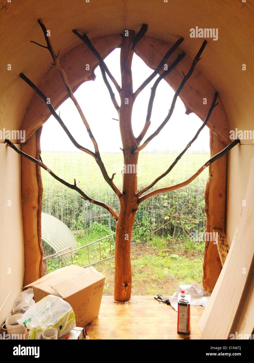 Interior picture window in a shepherds hut wagon under construction, Hampshire, England. Stock Photo