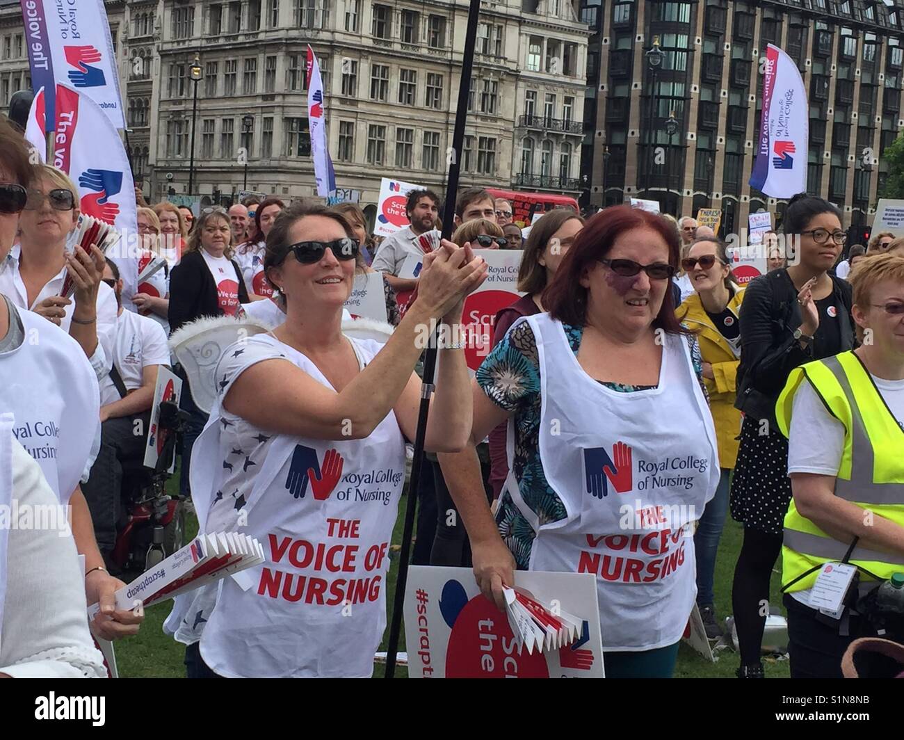 September 6th 2017 LondonThousands of nurses healthcare professions and members of the public gathered in Parliament t Square to protest loudly against the governments pay cap #scrapthecap - Smartphone Captured Stock Image
