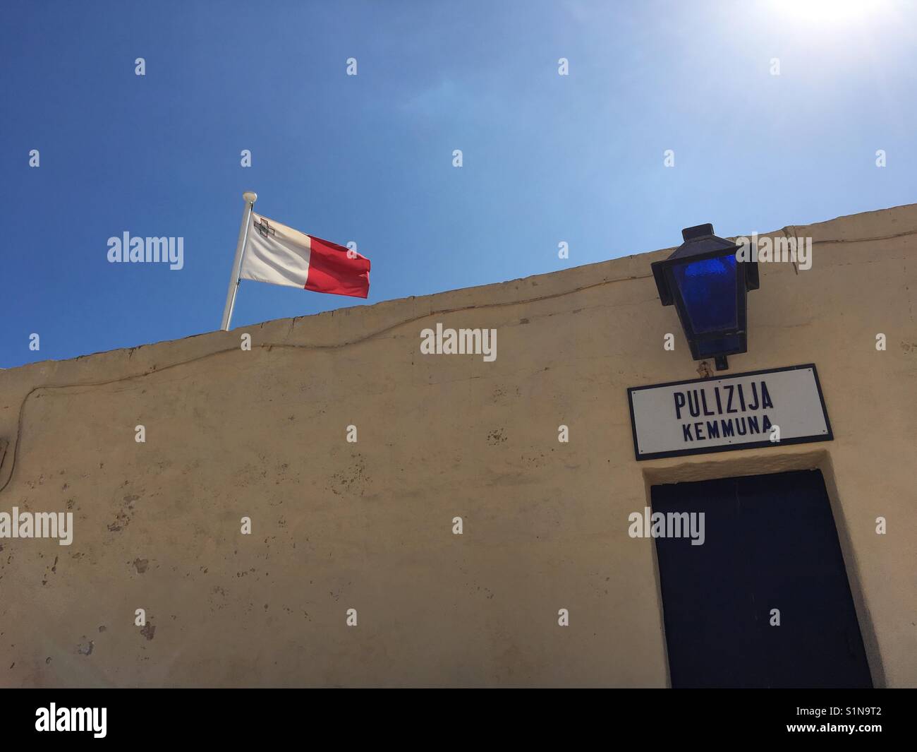 Maltese police station with flag on Comino, Malta Stock Photo Alamy