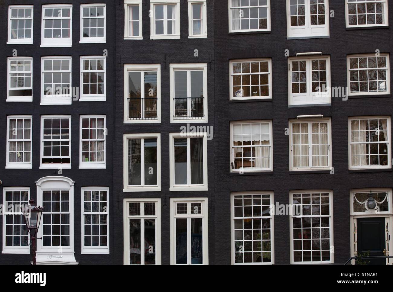 Typical house facades in Amsterdam, the Netherlands - Smartphone Captured Stock Image