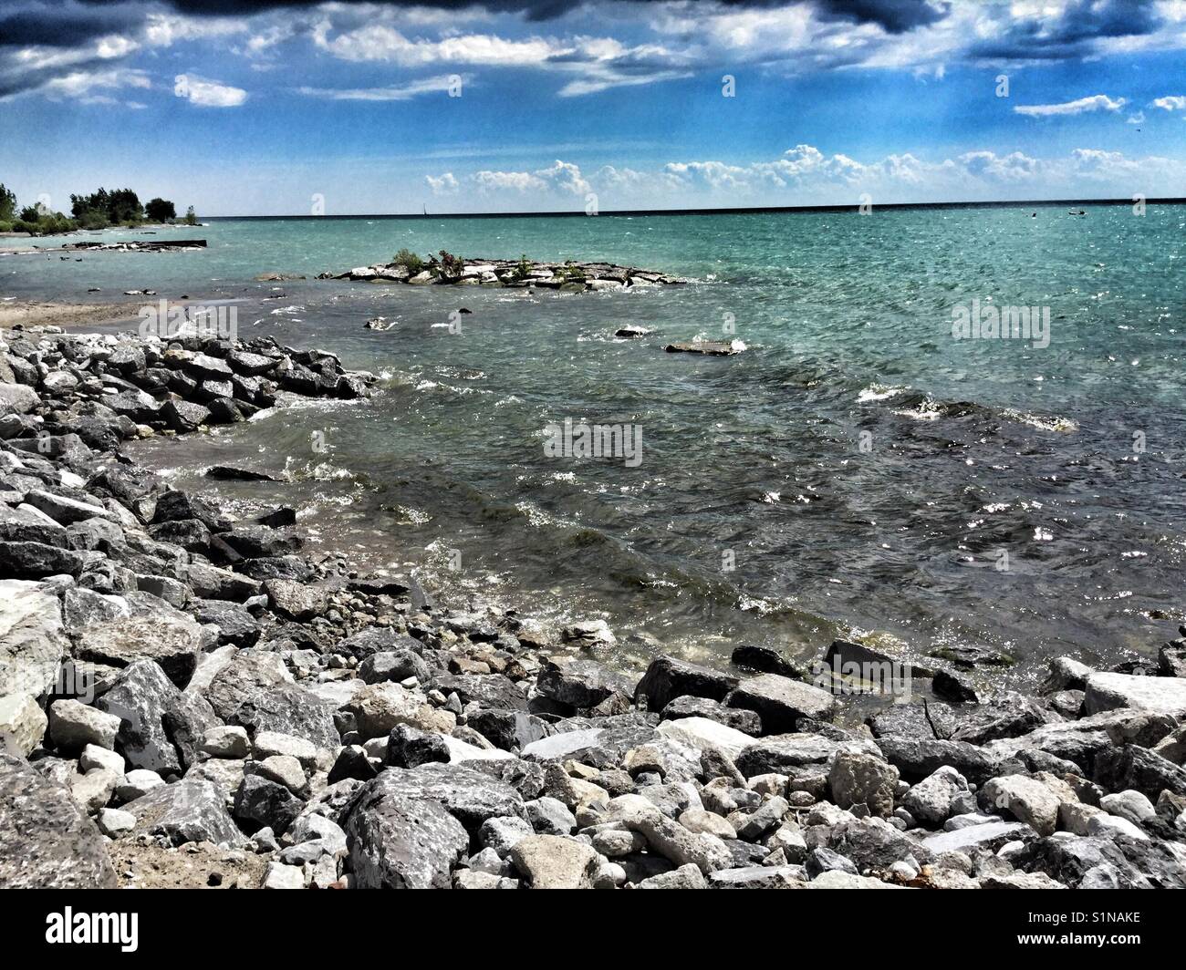 A rocky beach on Lake Ontario in Port Dalhousie. Stock Photo