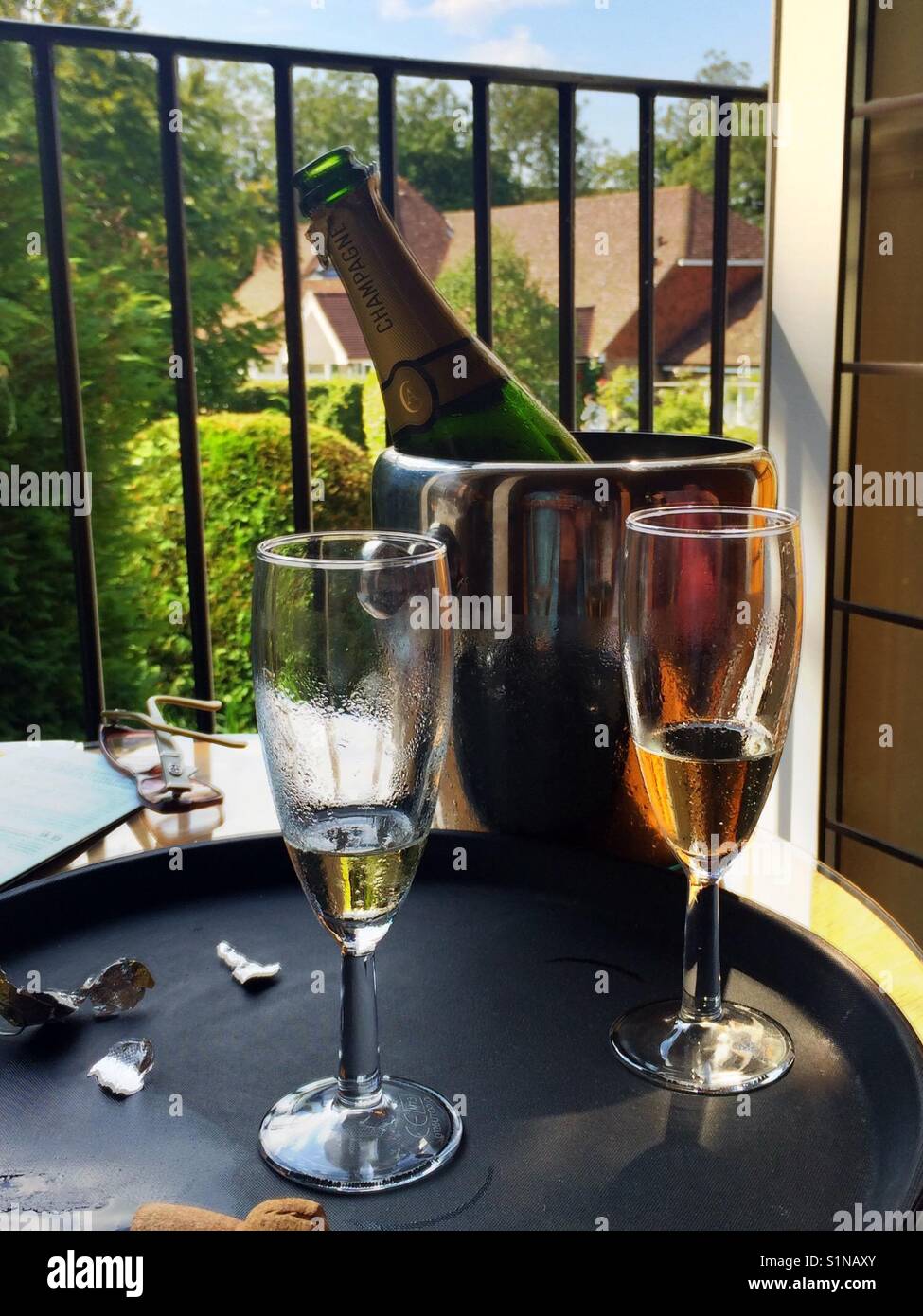 Two champagne glasses indoors on a summers day - Smartphone Captured Stock Image