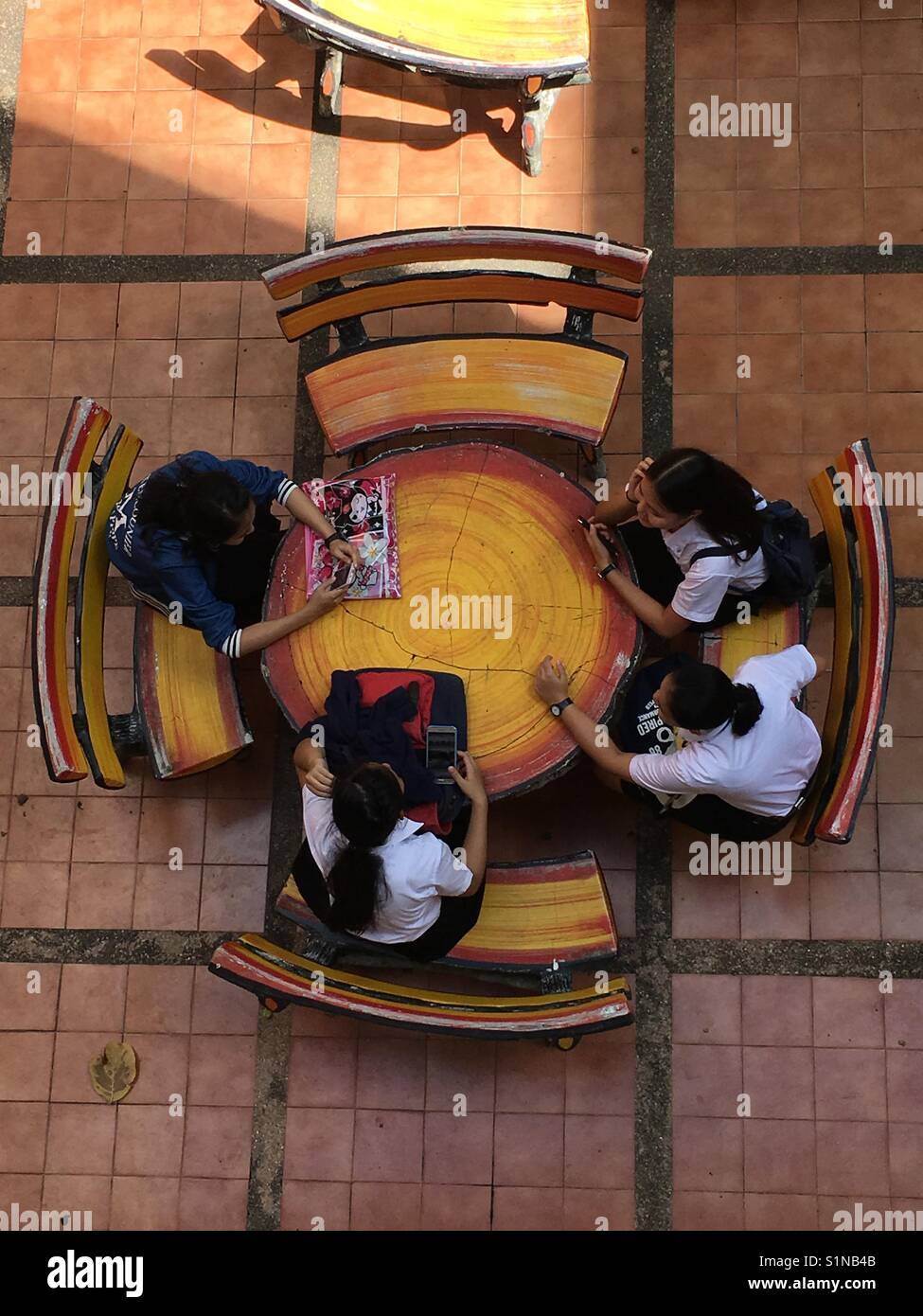 Students chilling between classes at Chiang Mai University in Thailand Stock Photo