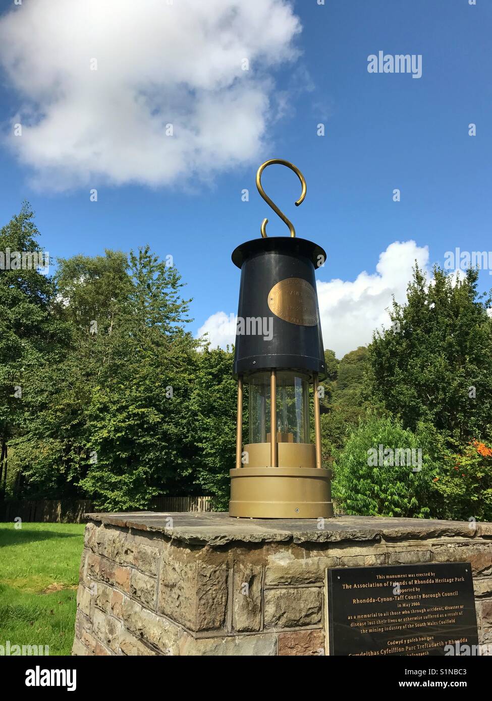 Large scale reproduction of a miner's lamp at the entrance to the Rhondda Heritage Park, which is located in the old Lewis Merthyr colliery - Smartphone Captured Stock Image