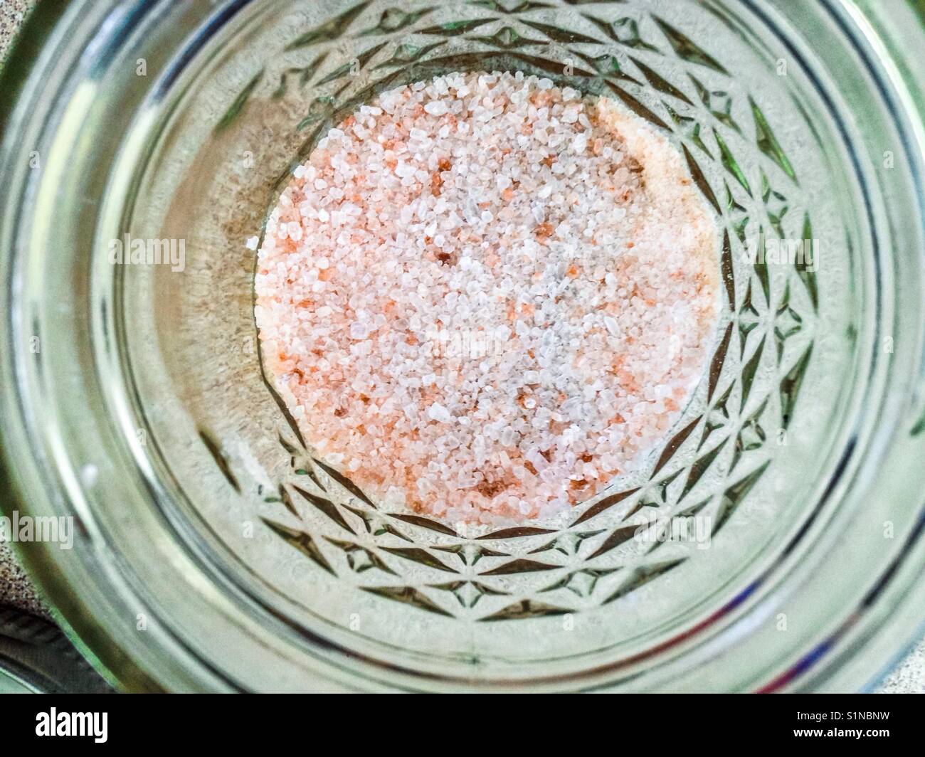 Pink Himalayan salt in a small canning jar- straight down - Smartphone Captured Stock Image