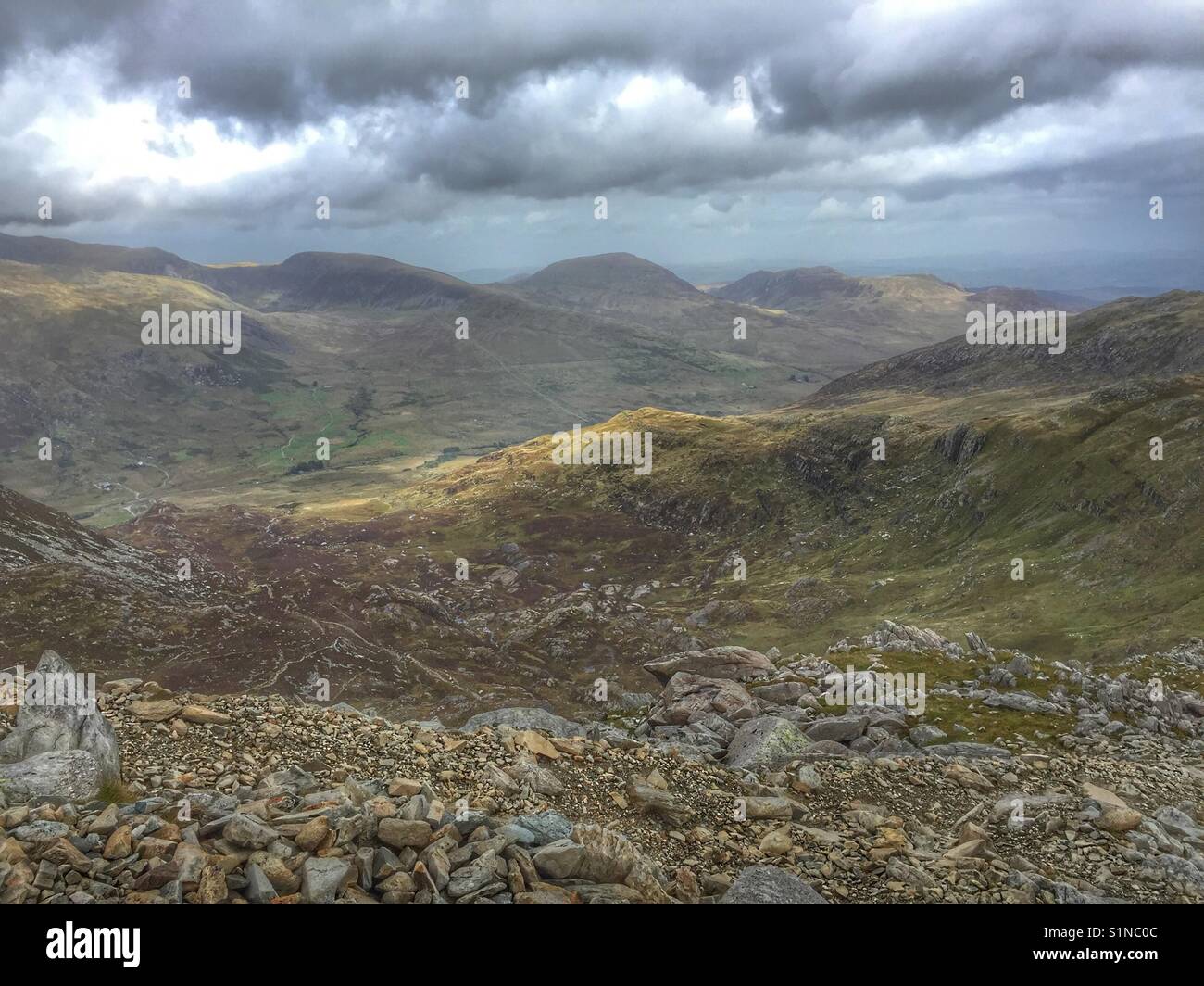 Sunlight on the Snowdonia mountain tops taken from the top of the Glyderau - Smartphone Captured Stock Image